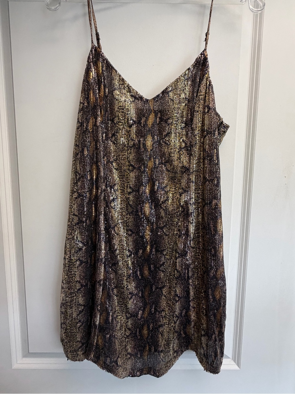 sequin snake print mini dress with a V-neckline and thin spaghetti straps